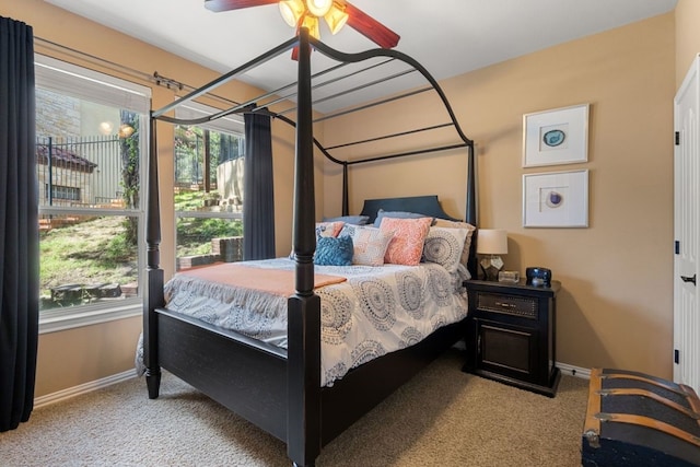 carpeted bedroom with multiple windows