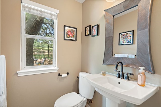 bathroom featuring sink and toilet