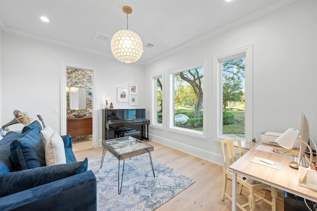 living room with ornamental molding and light wood-type flooring