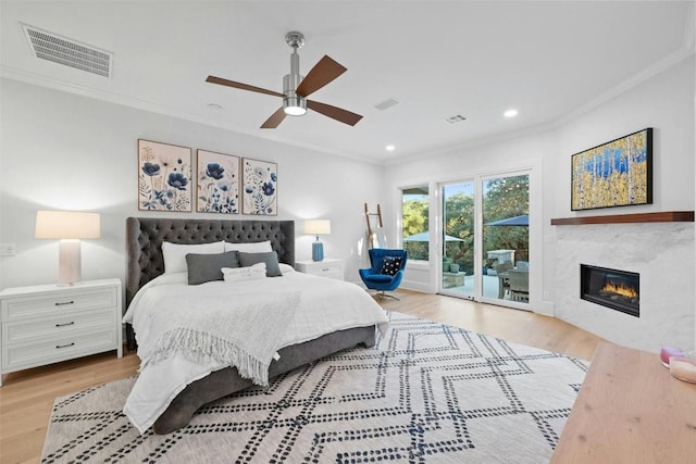 bedroom featuring crown molding, ceiling fan, access to exterior, and light wood-type flooring