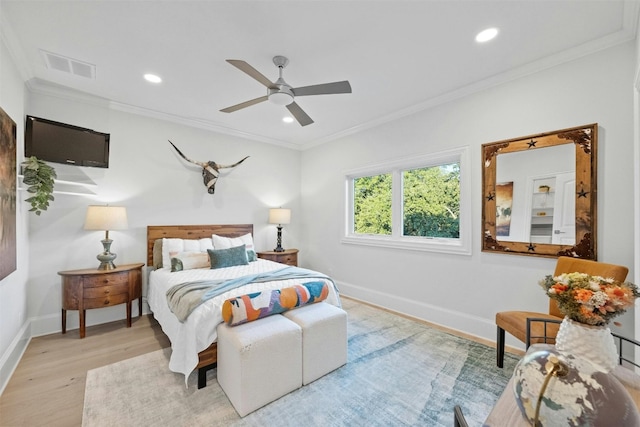 bedroom with ceiling fan, ornamental molding, and light hardwood / wood-style floors