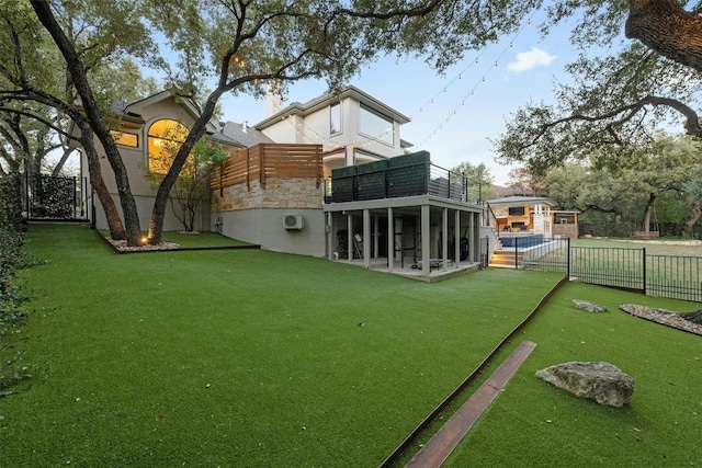 view of yard featuring a patio and a balcony