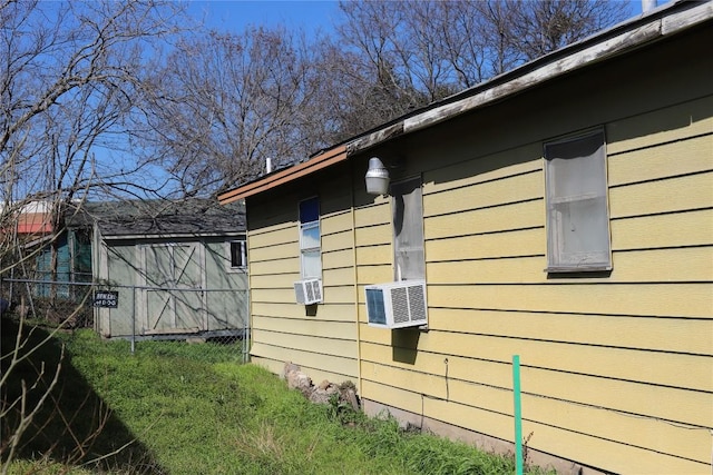 view of side of home with cooling unit