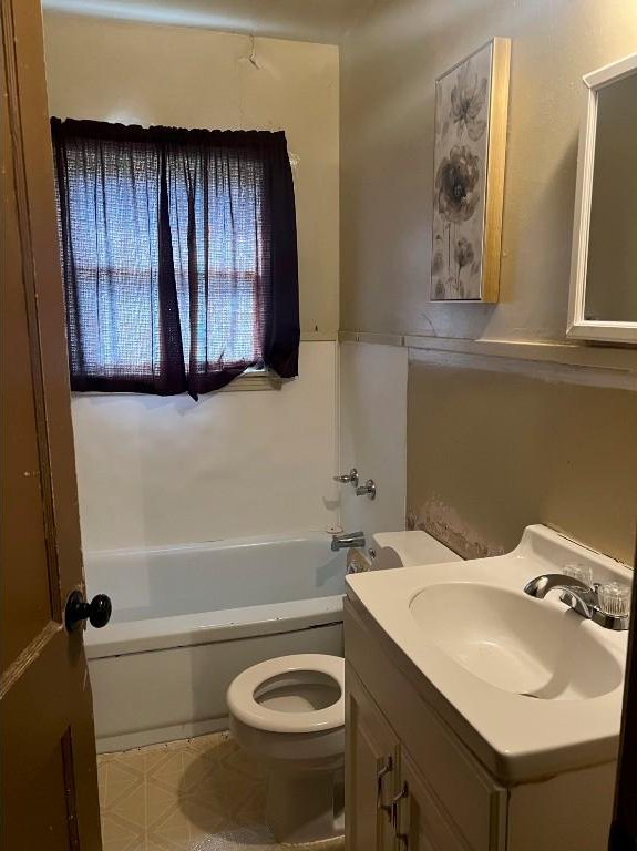 full bathroom with vanity, tub / shower combination, and toilet