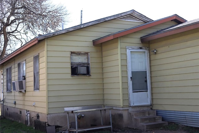 view of home's exterior with cooling unit