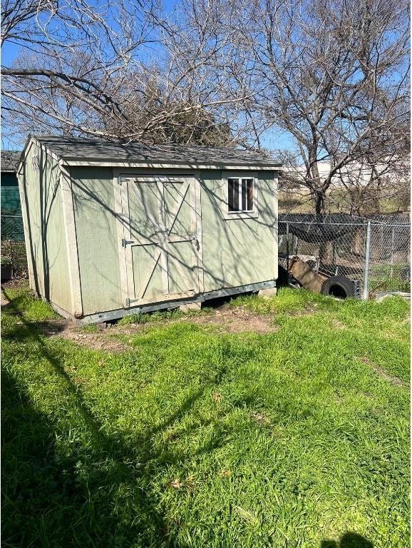 view of outbuilding featuring a yard