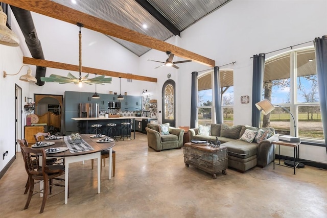 living room with beamed ceiling, ceiling fan, and high vaulted ceiling