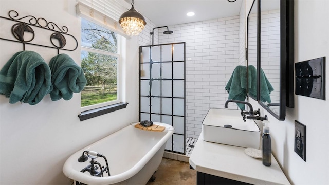 bathroom with independent shower and bath, vanity, and a chandelier