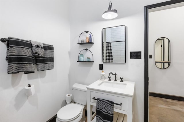 bathroom with vanity, toilet, concrete flooring, and a shower with shower curtain