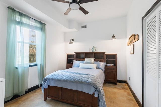 bedroom featuring light carpet and ceiling fan