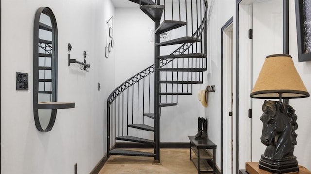 stairs featuring a high ceiling