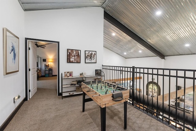 rec room featuring ceiling fan, beam ceiling, high vaulted ceiling, and carpet