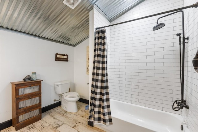 bathroom with vaulted ceiling, hardwood / wood-style floors, shower / tub combo, and toilet