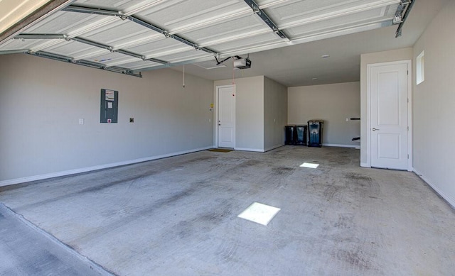 garage with baseboards, electric panel, and a garage door opener