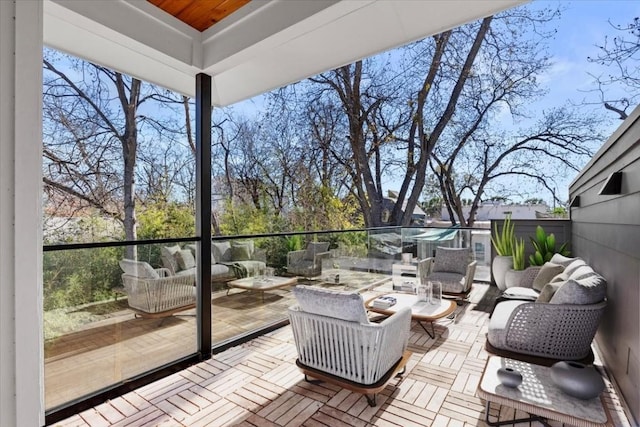 wooden terrace with outdoor lounge area