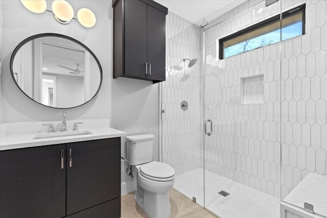 bathroom with walk in shower, vanity, and toilet