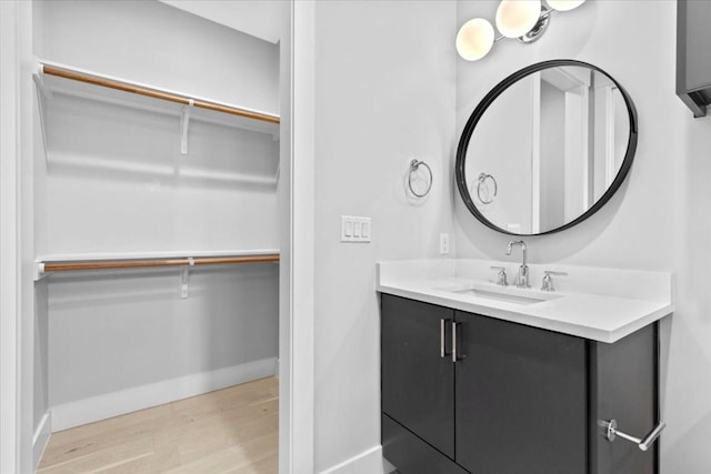 bathroom featuring vanity and hardwood / wood-style floors