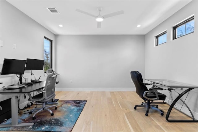 office featuring hardwood / wood-style flooring and ceiling fan