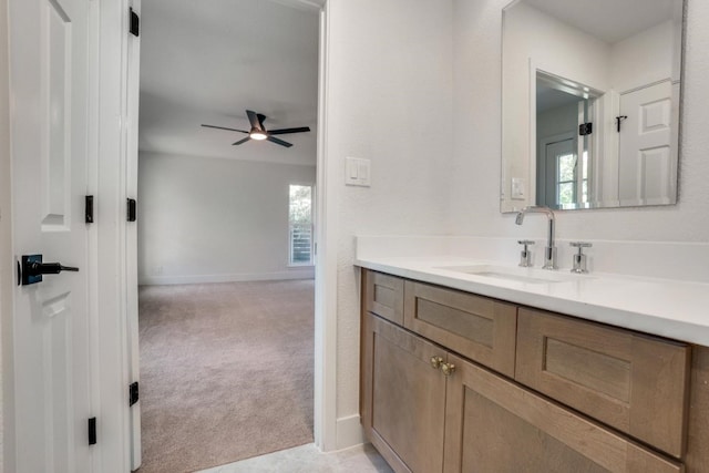 bathroom featuring ceiling fan, vanity, and a wealth of natural light