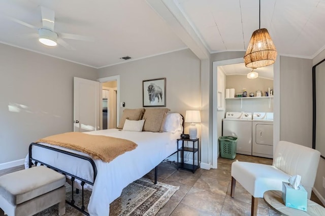 bedroom with crown molding and separate washer and dryer