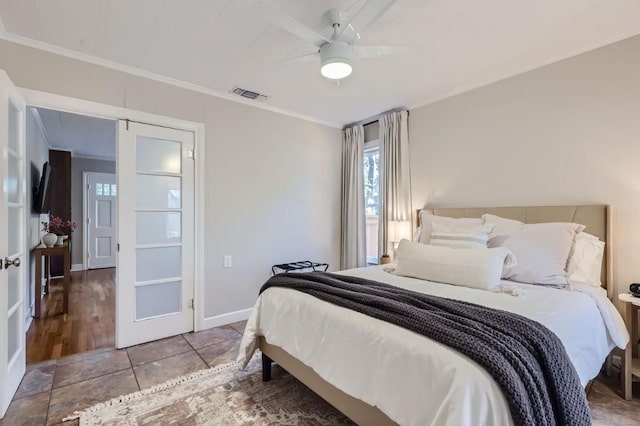 bedroom with ornamental molding and ceiling fan