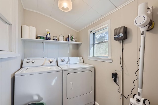 laundry area featuring separate washer and dryer and ornamental molding