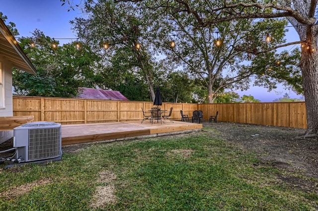 view of yard featuring a wooden deck and cooling unit