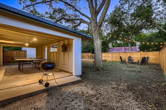 view of yard with a fire pit