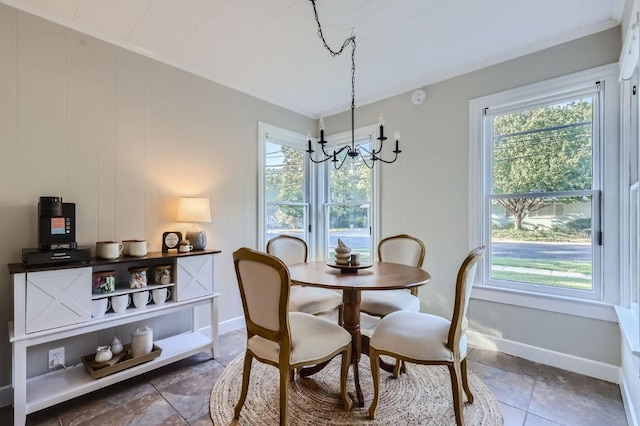 dining area with plenty of natural light and a chandelier