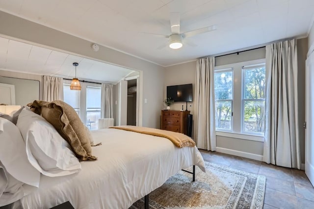 tiled bedroom with ceiling fan