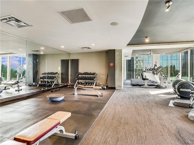 gym with visible vents and floor to ceiling windows