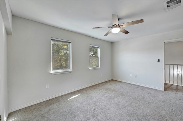 unfurnished room featuring carpet floors and ceiling fan