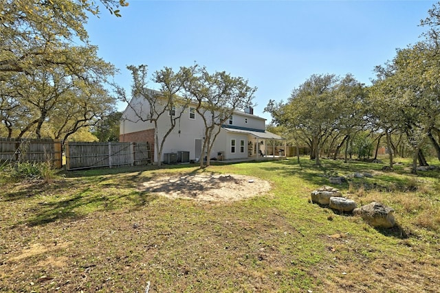 view of yard with central AC unit