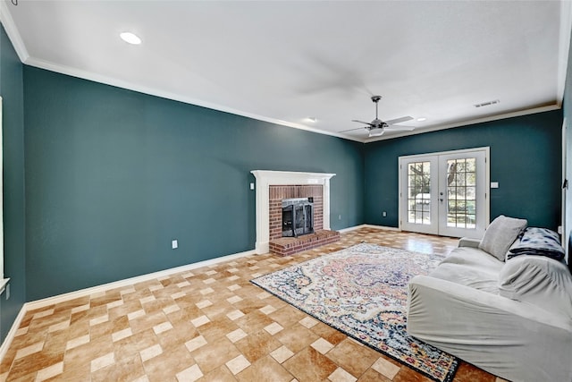 living room featuring a fireplace, ornamental molding, french doors, and ceiling fan