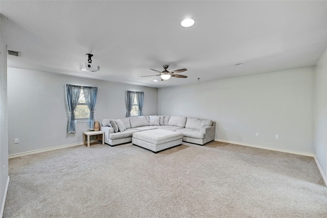 living room featuring light carpet and ceiling fan