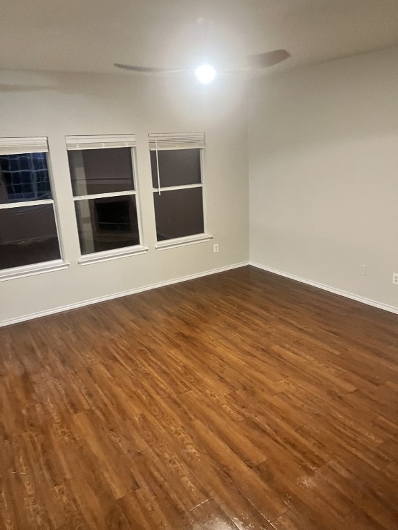 spare room featuring dark hardwood / wood-style floors