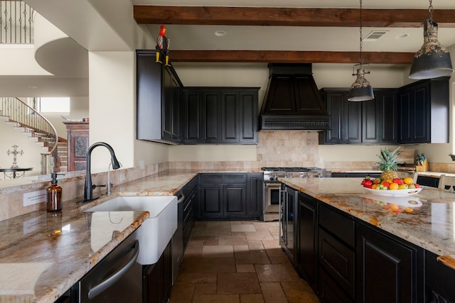 kitchen with pendant lighting, appliances with stainless steel finishes, light stone countertops, and custom exhaust hood