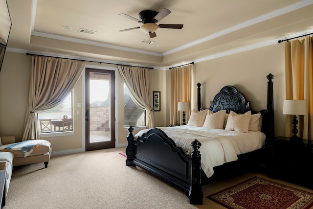 bedroom featuring carpet floors, access to exterior, ceiling fan, a raised ceiling, and crown molding