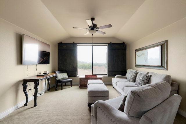 living room featuring ceiling fan, light colored carpet, and vaulted ceiling