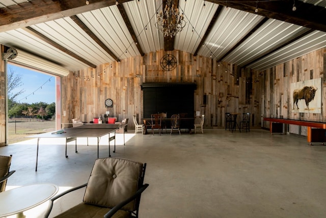 interior space featuring lofted ceiling and concrete flooring