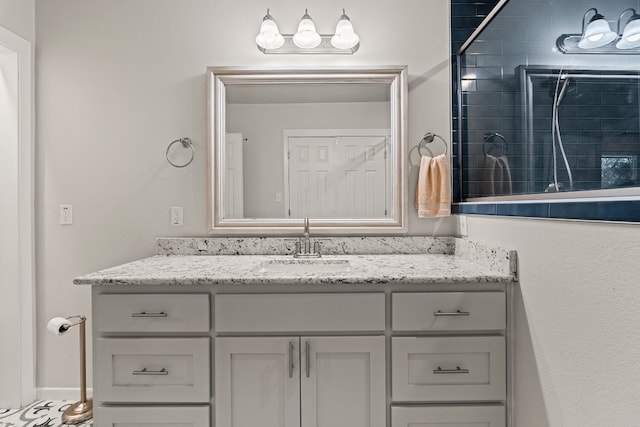 bathroom featuring vanity and a tile shower