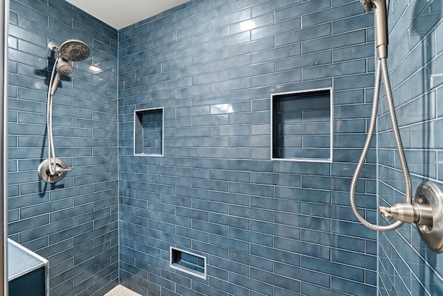 bathroom with tiled shower