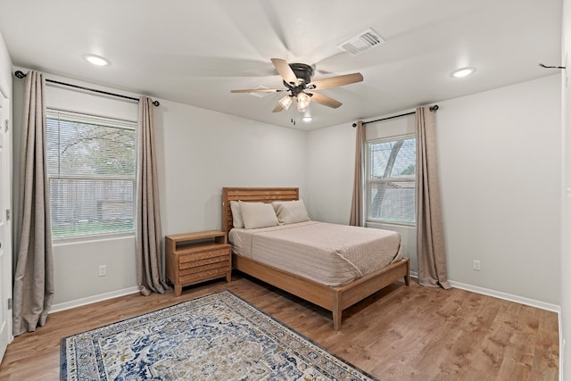 bedroom featuring ceiling fan and wood-type flooring