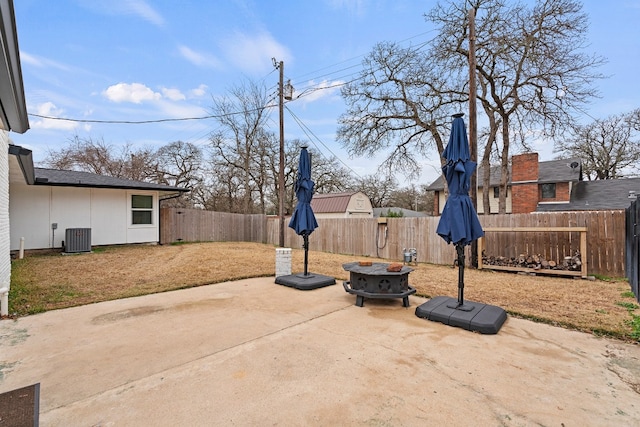 view of patio featuring a fire pit and central air condition unit