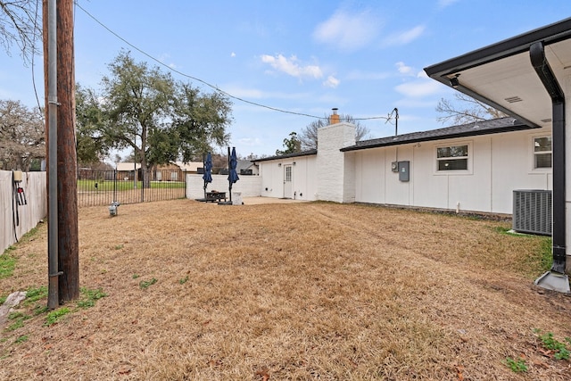 view of yard with central AC