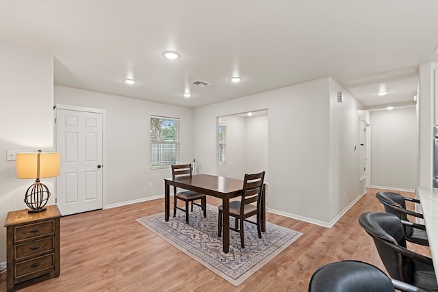 dining room with light wood-type flooring