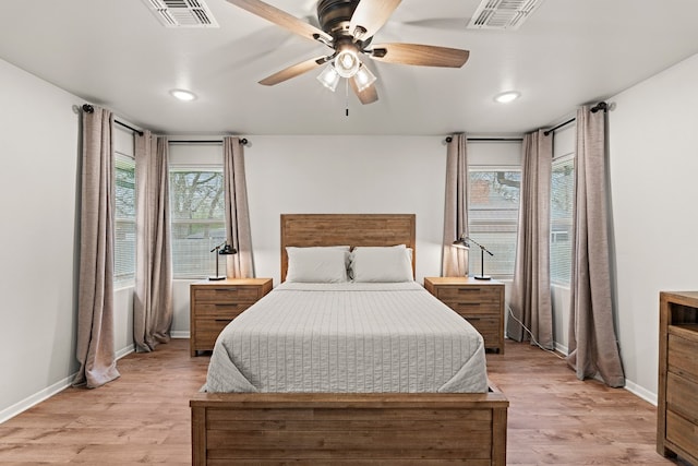 bedroom featuring light hardwood / wood-style flooring and ceiling fan