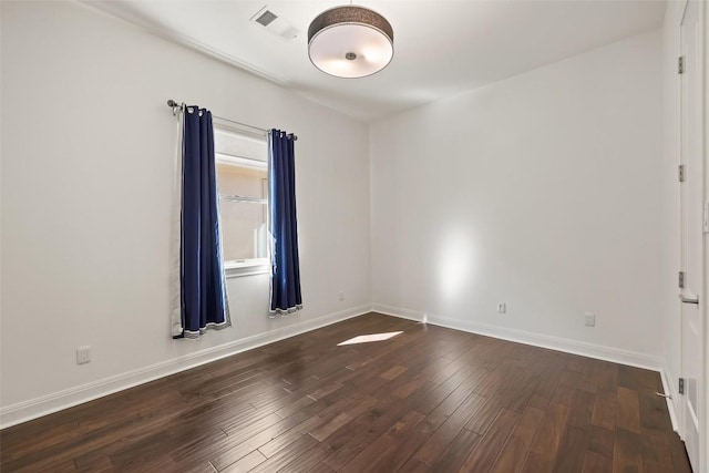 empty room featuring dark wood-type flooring