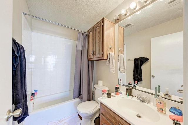 full bathroom featuring toilet, vanity, a textured ceiling, and shower / bath combo with shower curtain