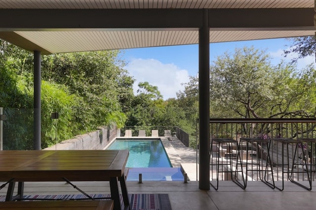 view of swimming pool with a patio area